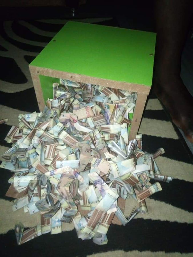 Nigerian lady shows off N5.3 million she saved in her piggy bank within 10 months