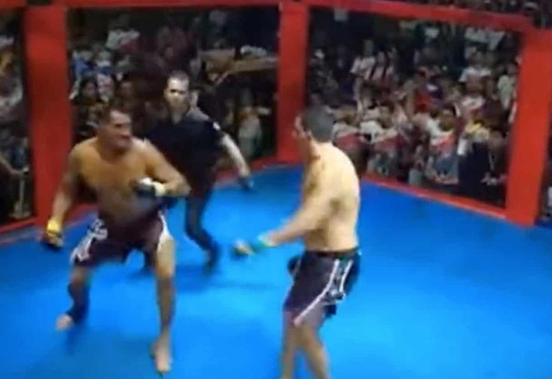 Two feuding politicians settle their differences by fighting in a wrestling ring while hundreds watch